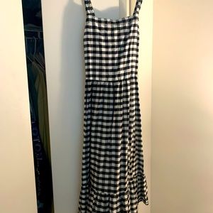 Beautiful gingham black and white loft midi dress. Criss cross straps in back